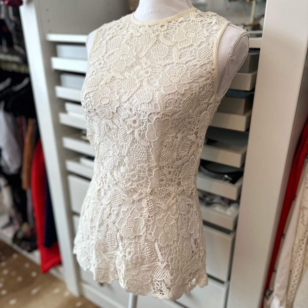 CAbi Open Knit Needle Lace Sleeveless Peplum Top ~Size  XS.
Smoke Free home